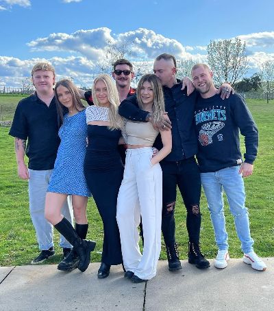 Ashley Youle and her boyfriend, Mitch Baker, took a picture with their friends on Mitch's birthday.